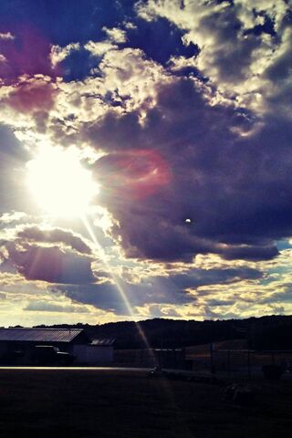 Radiant Horizons: A Dance of Light and Clouds