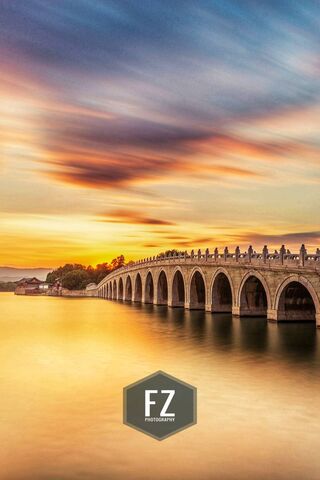 Sunset Serenity at Lakeside Bridge 🌅🌉