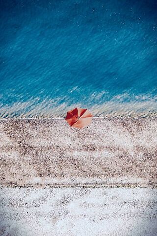 Beachside Serenity: The Lonely Umbrella