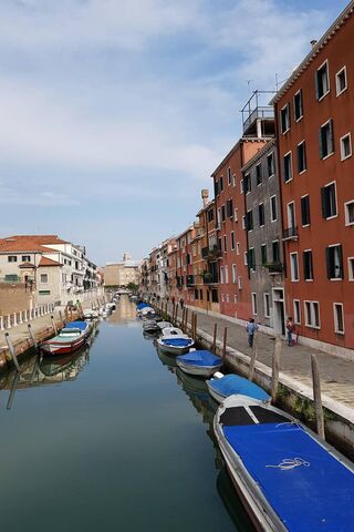 Serenity on the Canals: Venice's Blue Boats