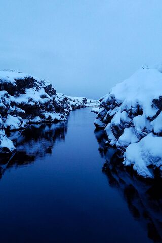 Where Land Meets Water: A Chilly Embrace