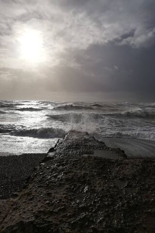 Whispers of the Ocean: A Stormy Embrace 🌊☁️