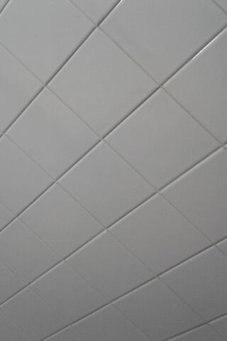 Sleek Serenity: The White Tile Canvas