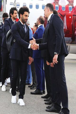 Salah's Grand Arrival: A Star Among Champions 🌟✈️