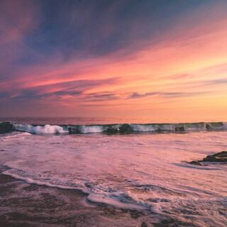 sunset-symphony-waves-of-color-wallpaper-download-to-your-mobile