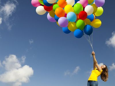 Girl Flying With Baloon