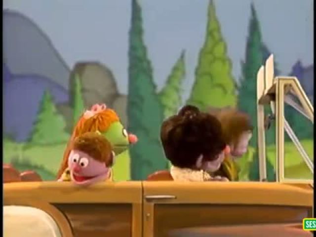 Sesame Street- riding a car