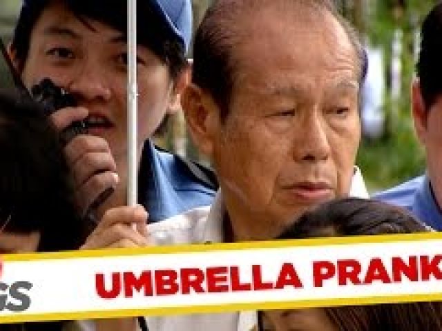 Uninvited Strangers Share Same Umbrella
