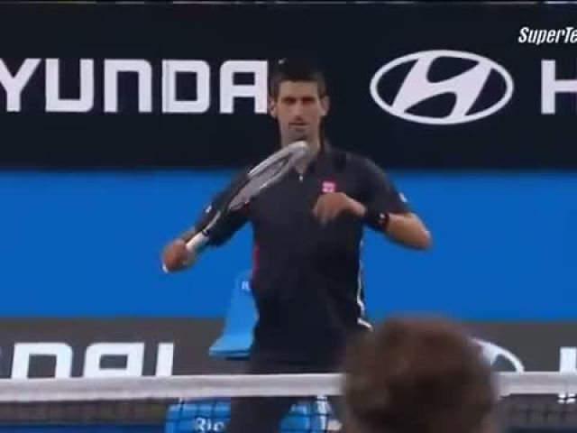 Ana Ivanovic throwing a ball at Novak Djokovic to stop him dancing