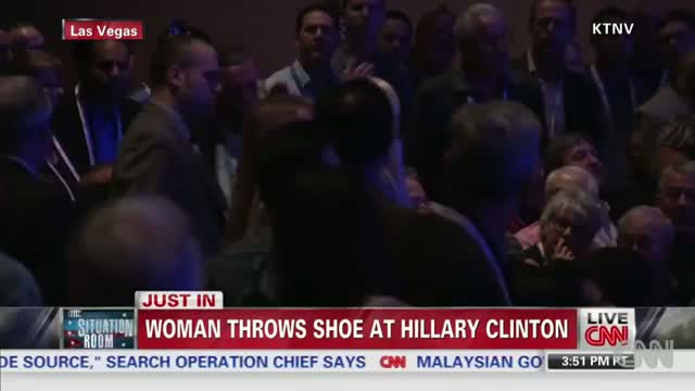 Watch Hillary Clinton dodge a shoe on stage